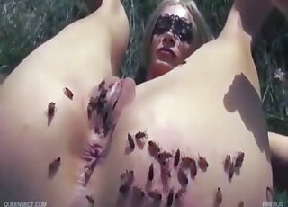 Kinky blonde is using small insects on her pussy for sexual pleasure