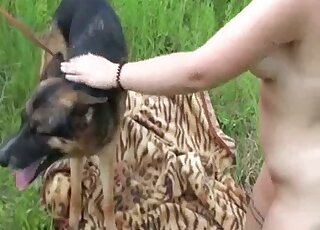 German Shepherd got outdoor blowjob favor from slutty lady