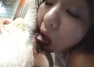 Nasty Japanese zoophile is happy licking this dog's butthole on cam