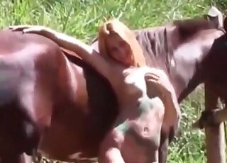 Slender blond zoophile babe undresses and starts making out with a horse