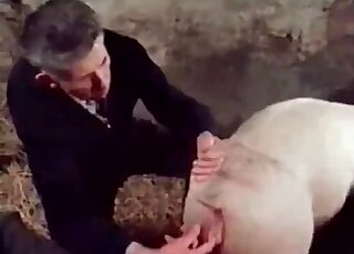 Mature zoophile decides to fuck a pig next to a naked blond bitch