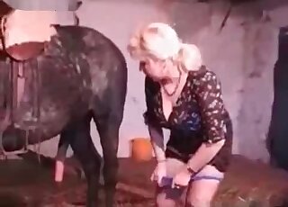 Mature slut jerks off stallion’s dick to make him cum on her boobs
