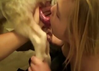 Charming blonde takes care of a dog's cock orally in zoo sex tape